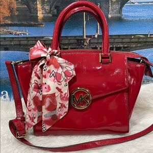 Michael Kors Red Patent Leather Satchel with Structured Design and Gold Emblem